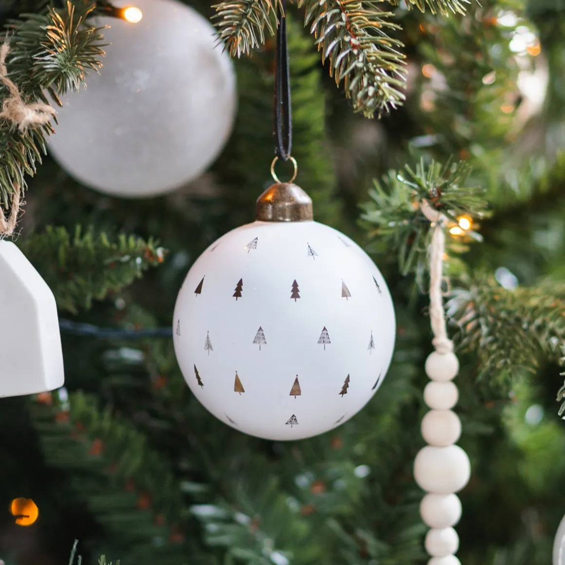 White Christmas Bauble With Cut-Out Christmas Trees